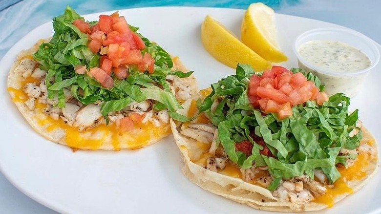 Two fish tacos on a plate at Paia Fish Market