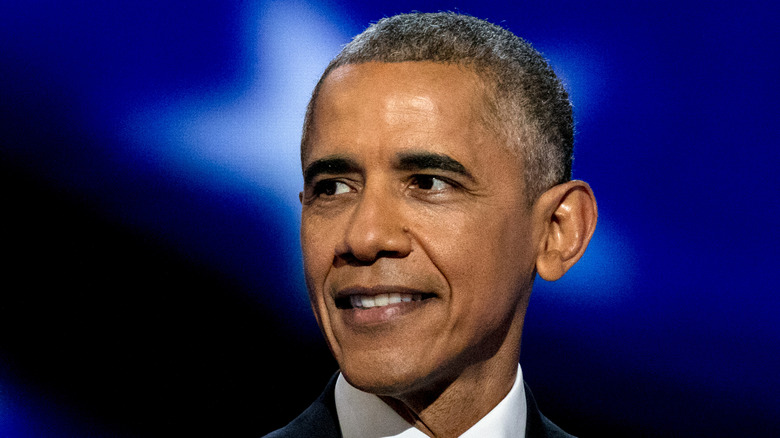 Barack Obama against a blue background