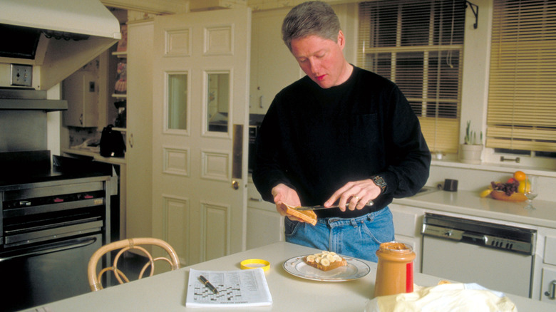Bill Clinton making a peanut butter and banana sandwich in his kitchen in Arkansas in 1992