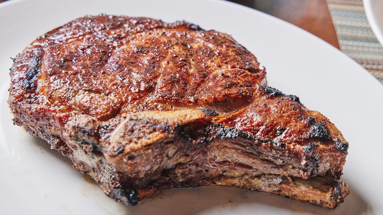 Dry-aged ribeye steak on plate