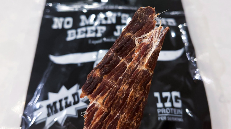 A strip of No Man's Land jerky against its package
