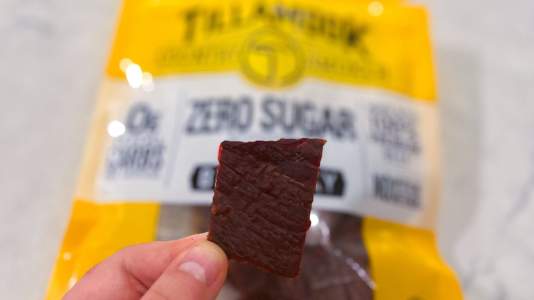 A strip of Tillamook jerky against its package
