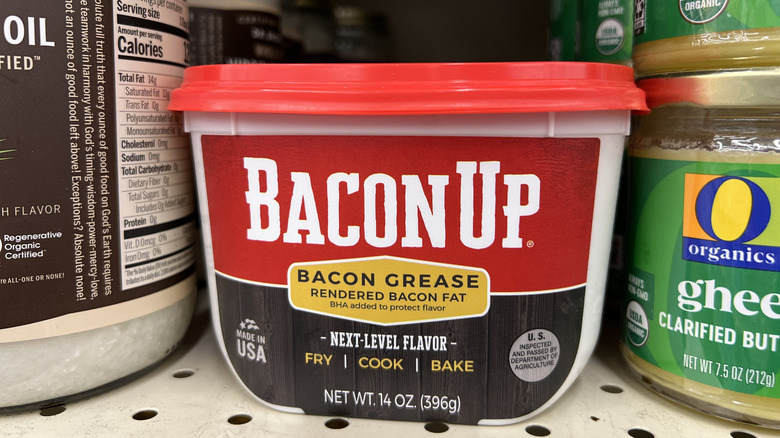 A tub of Bacon Up bacon grease on a supermarket shelf