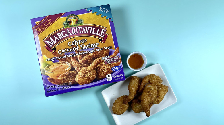 Margaritaville Calypso Coconut Shrimp, both the original packaging and on a small plate with dipping sauce served on the side