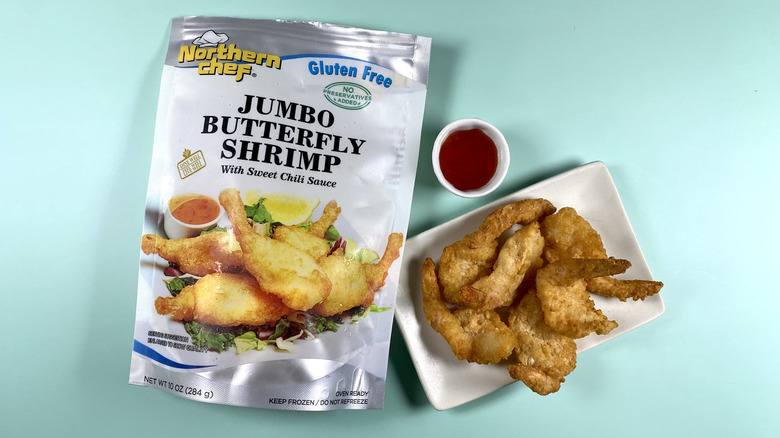 Northern Chef Jumbo Butterfly Shrimp, both the original packaging and on a plate with the sauce on the side