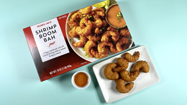 Trader Joe's Shrimp Boom Bah, both the original packaging and on a plate with the sauce served on the side