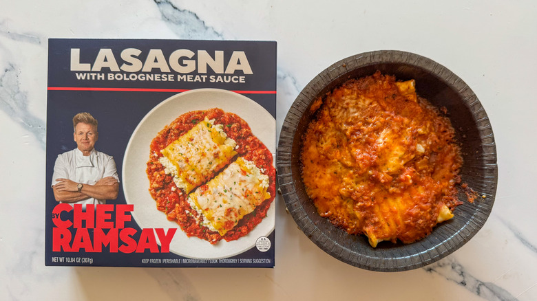 Lasagna with packaging on marble surface