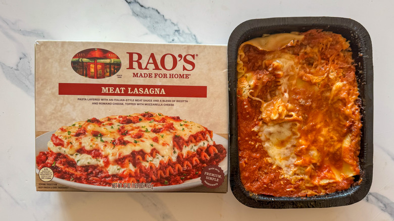 Lasagna with packaging on marble surface
