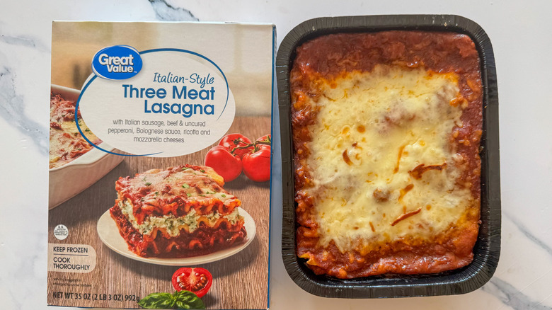 Lasagna with packaging on marble surface