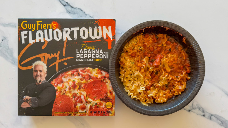 Lasagna with packaging on marble surface