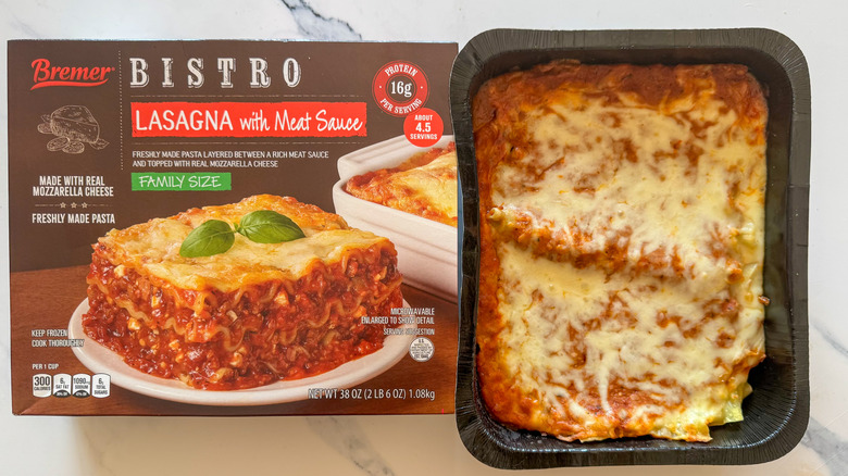 Lasagna with packaging on marble surface