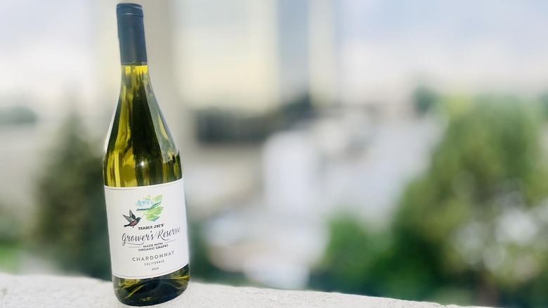 Bottle of Trader Joe's Grower's Reserve Organic Chardonnay sitting on outdoor ledge