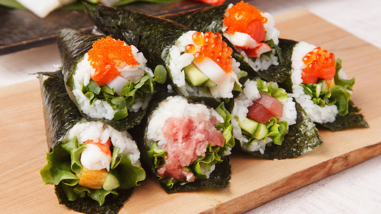 a platter of various temaki rolls
