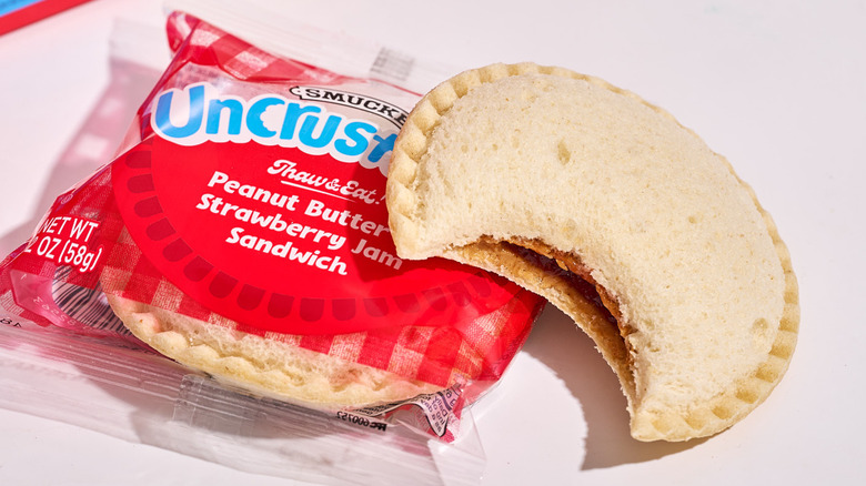 A strawberry jelly Uncrustable on a table