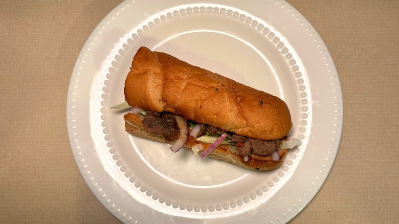A hot honey steak Subway sandwich with red onions
