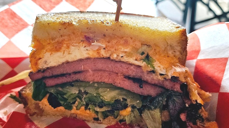 Sliced bologna sandwich on tray