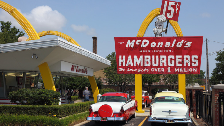 Vintage cars outside an old McDonald's from the 1960s