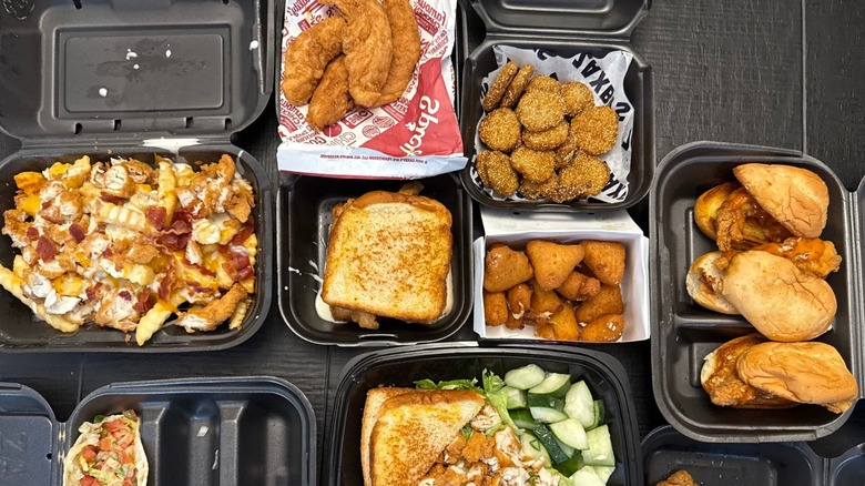 Several Zaxby's food items on a black table