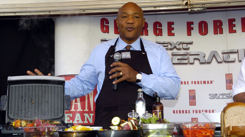 George Foreman using a George Foreman grill in a product demo