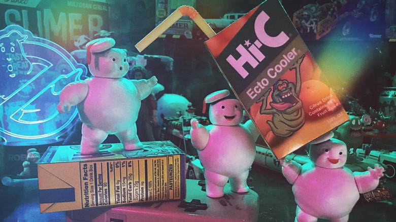 Ghostbuster-style costs holding up a juice fox of Hi-C Ecto Cooler