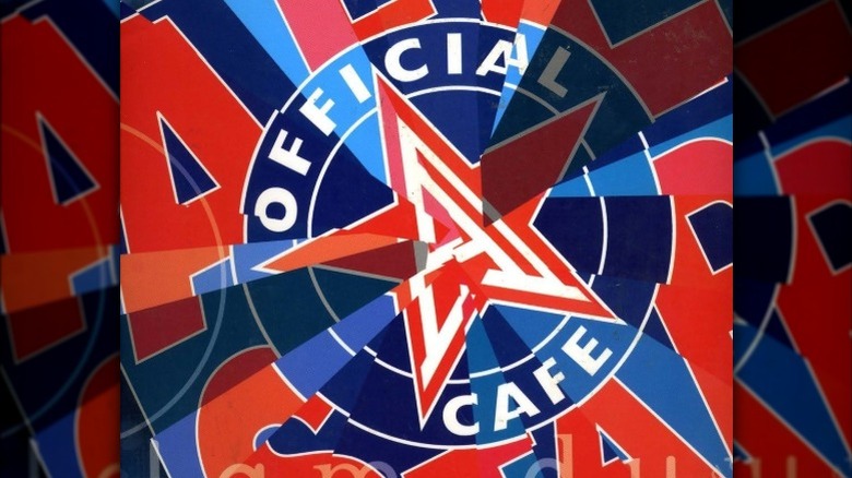 A photo of The Official All Star Cafe's flagship sports bar in Times Square in New York City features the brand's famous star-inset-in-a-circle logo along with images of some of the legendary pro athletes who invested in the business, including Wayne Gretszky, Andrei Agassi, Joe Montana, and Shaquille O'Neal..