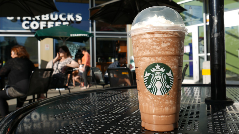 Iced Starbucks drink on outdoor table