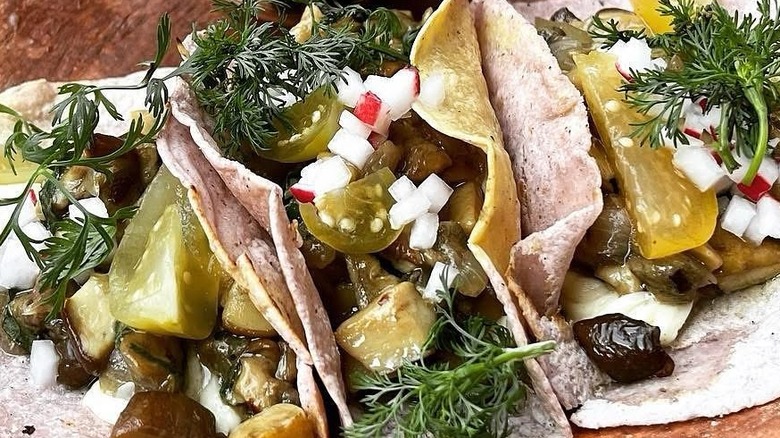 Three tacos on a plate at Levadura de Olla Restaurante in Oaxaca