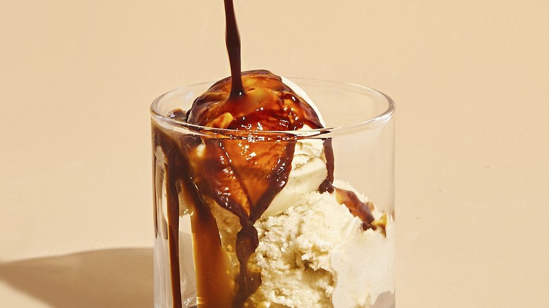 pouring sauce on ice cream