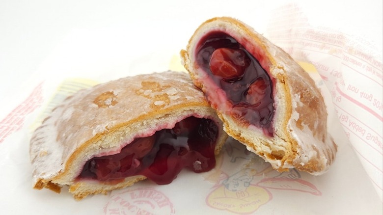 A Hubig's cherry hand pie split open on its wrapper