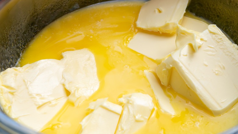 Close-up of glass bowl filled with melted butter