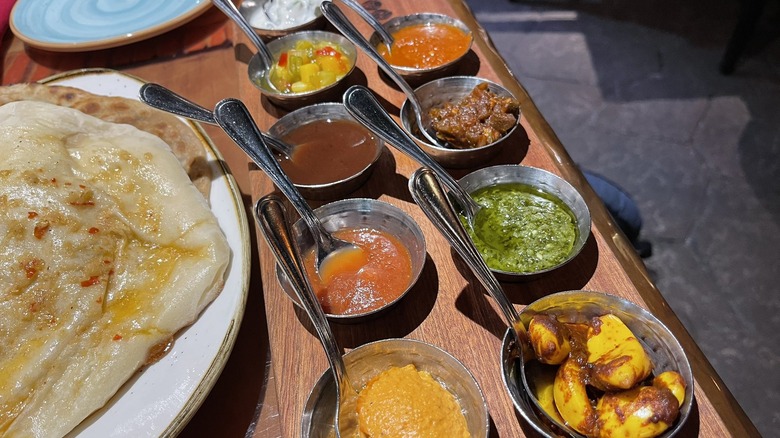 Bread service with assorted sauces at Sana
