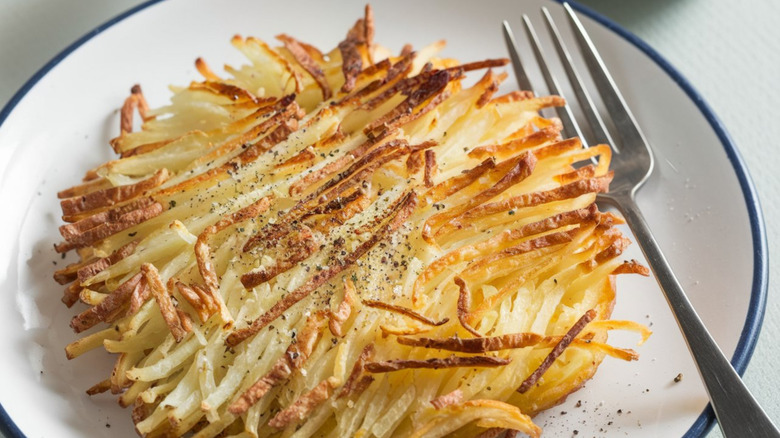 Hash Browns: Shredded or diced potatoes pan-fried until crispy. Golden-brown, seasoned with salt and pepper—essential breakfast side.