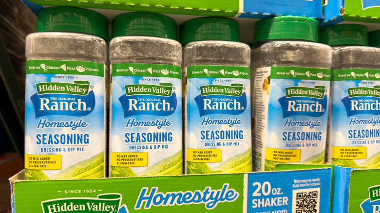 Bottles of ranch seasoning on a store shelf.