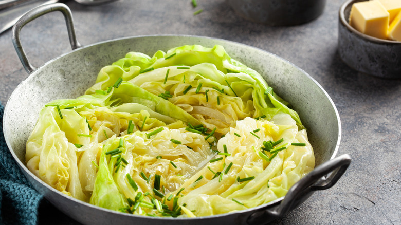 cabbage in a bowl with butter and herbs