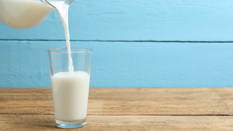 Milk pouring into glass