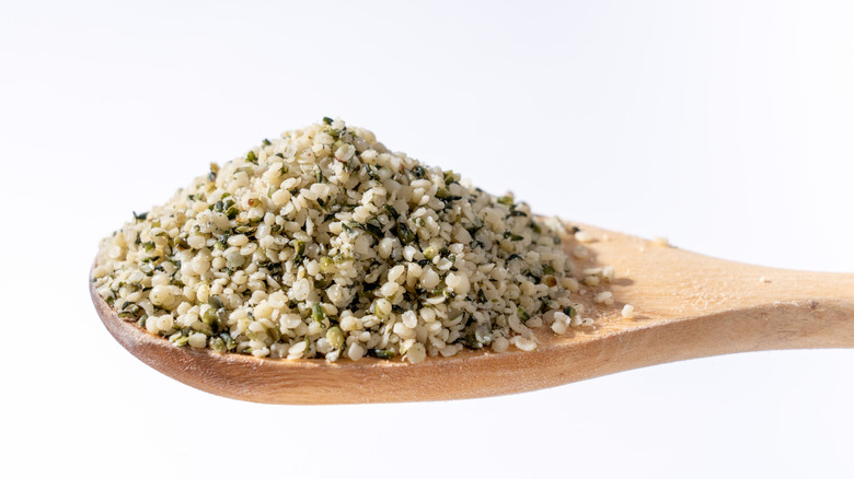 Hemp hearts on wooden spoon
