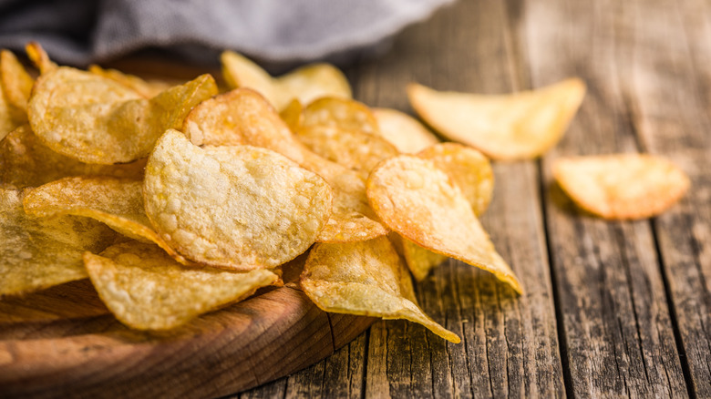 potato chips on wood board