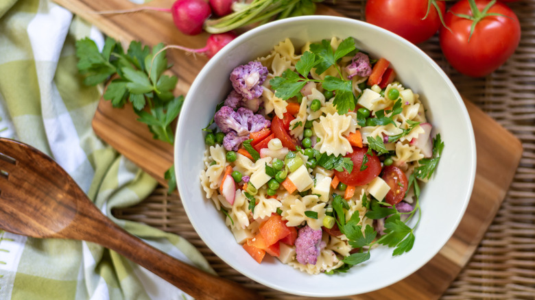 Pasta salad served in a white bowl