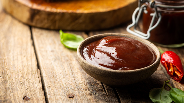 small bowl of steak sauce on wood table