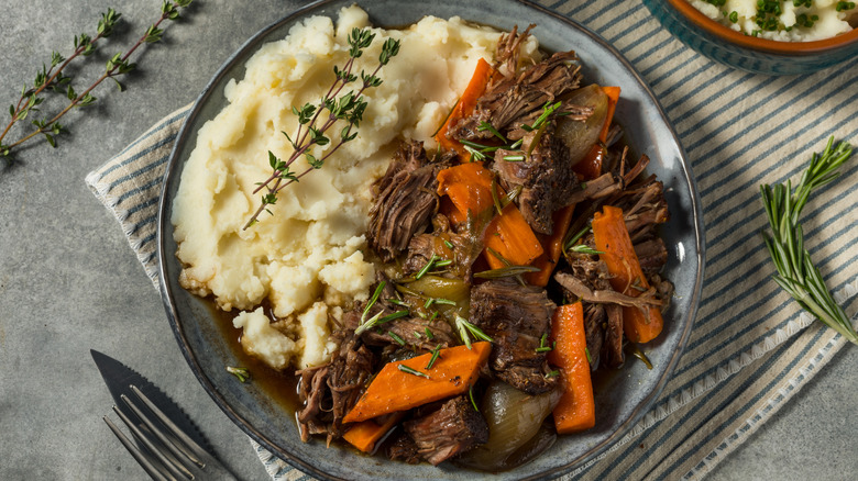 Plate of pot roast with mashed potatoes