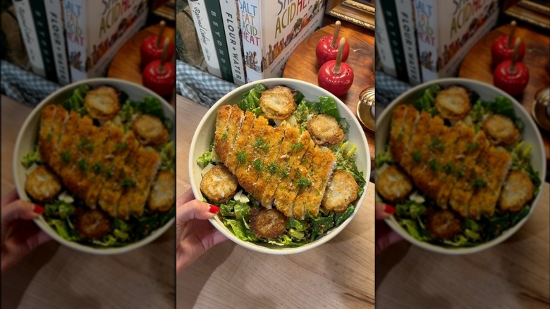 Chicken Caesar salad with fried pickles on top