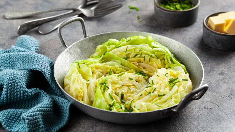 Steamed cabbage in a metal roasting pan.