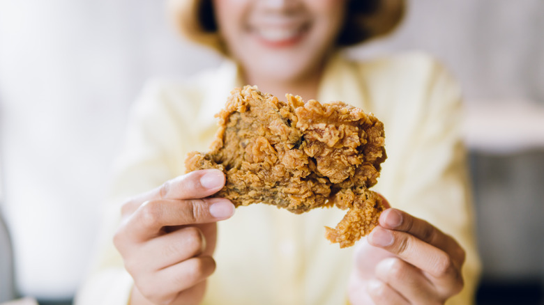 woman about to enjoy fried chicken