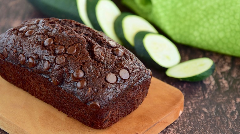 Chocolate zucchini loaf cake on a cutting board
