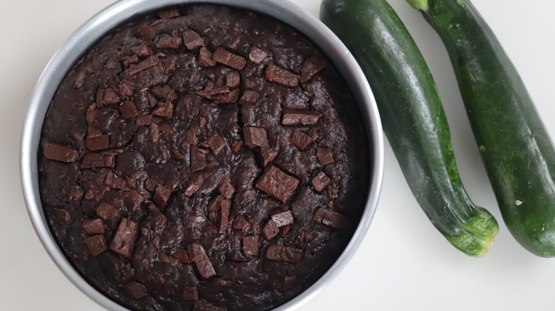 Overhead view of chocolate cake and zucchini