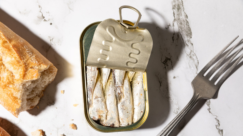 A can of sardines is open