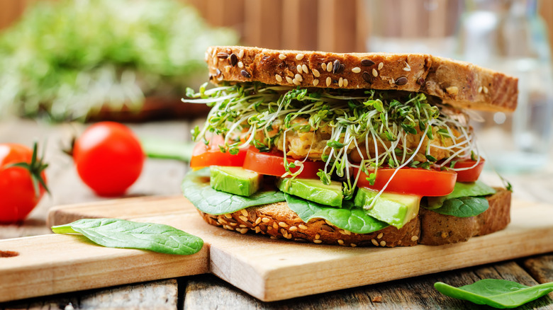 vegetable sandwich with avocados, tomatoes, microgreens