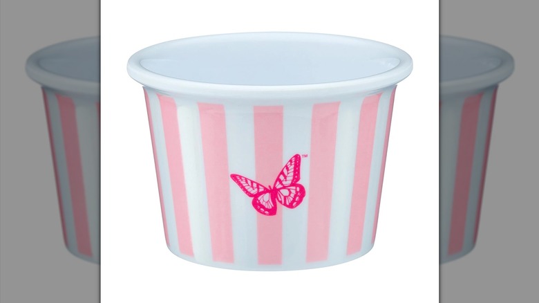 Sturdy pink and white striped plastic cup with a hot pink butterfly printed over the stripes