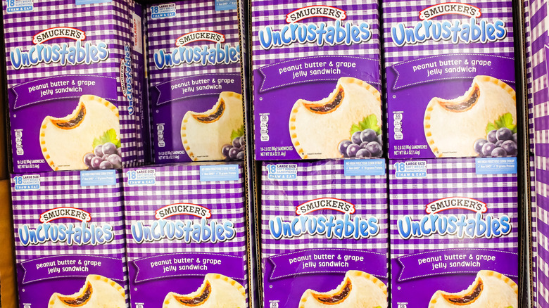Boxes of Uncrustables on a store shelf.