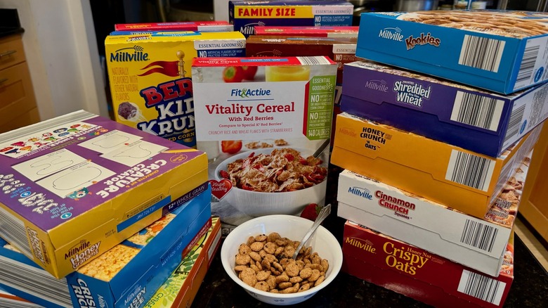 assortment of cereal boxes arranged on black table